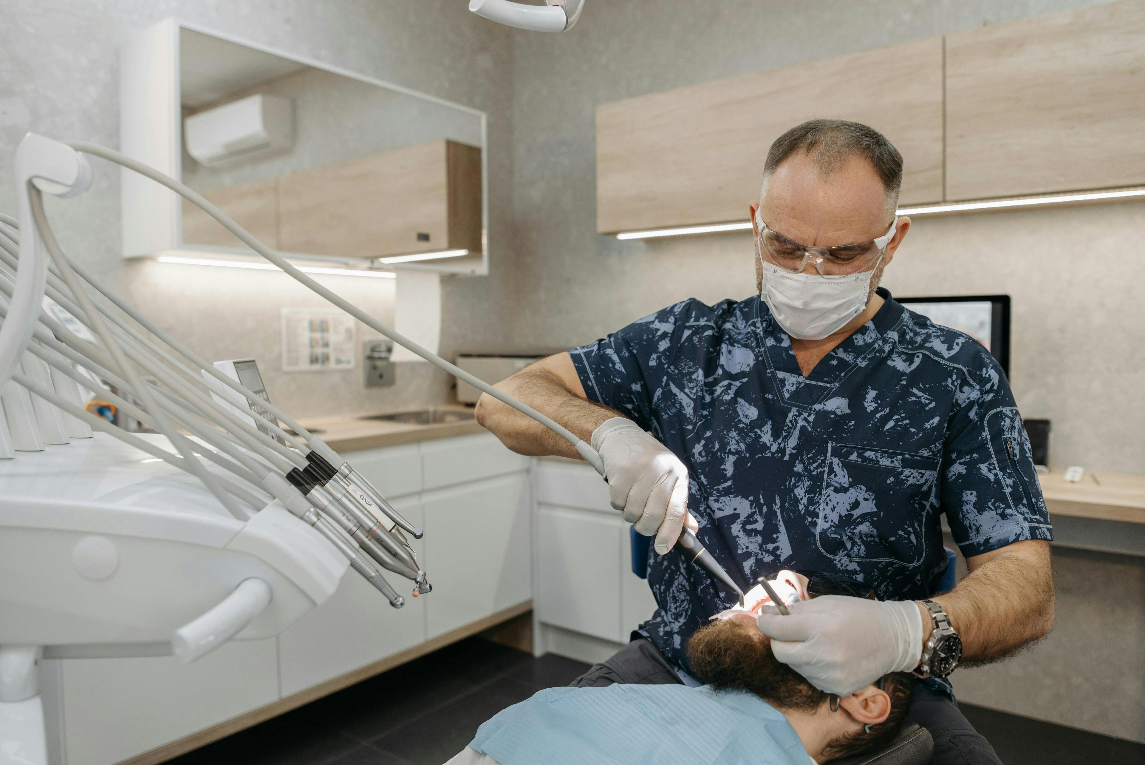 Doctor performing a breast examination on a male patient